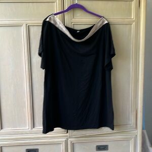 Black top with Laser cut lace across neckline. XL
